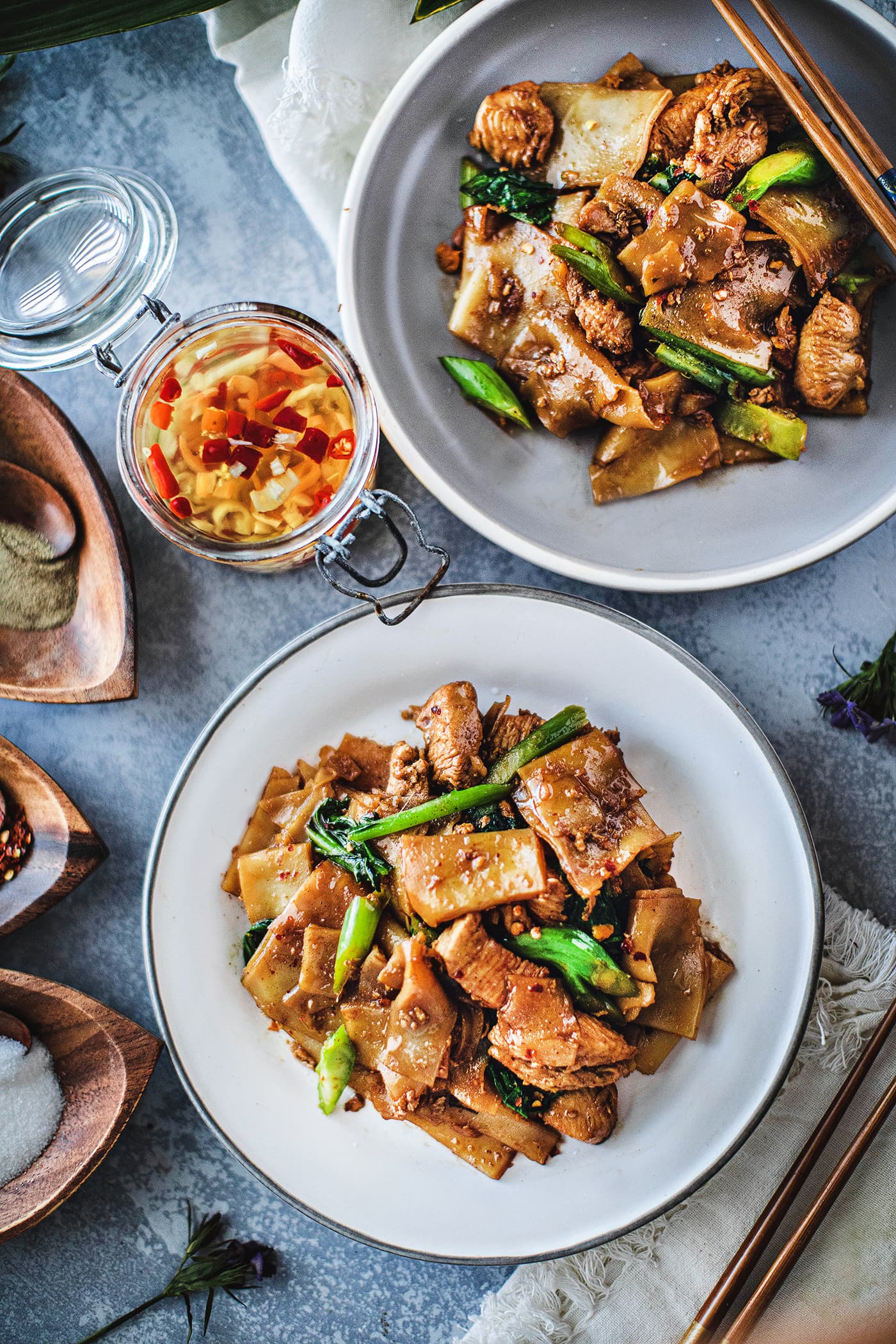 Pad See Ew is one of the most delicious Thai stir fry dishes! It uses wide rice noodles, garlic, eggs, sauces, and Chinese broccoli. This popular street food has a silky and savory flavor from the use of Thai sauces, making this Pad See Ew recipe delightfully memorable. #padseeew #thaifood #padseeewrecipe #senyai 