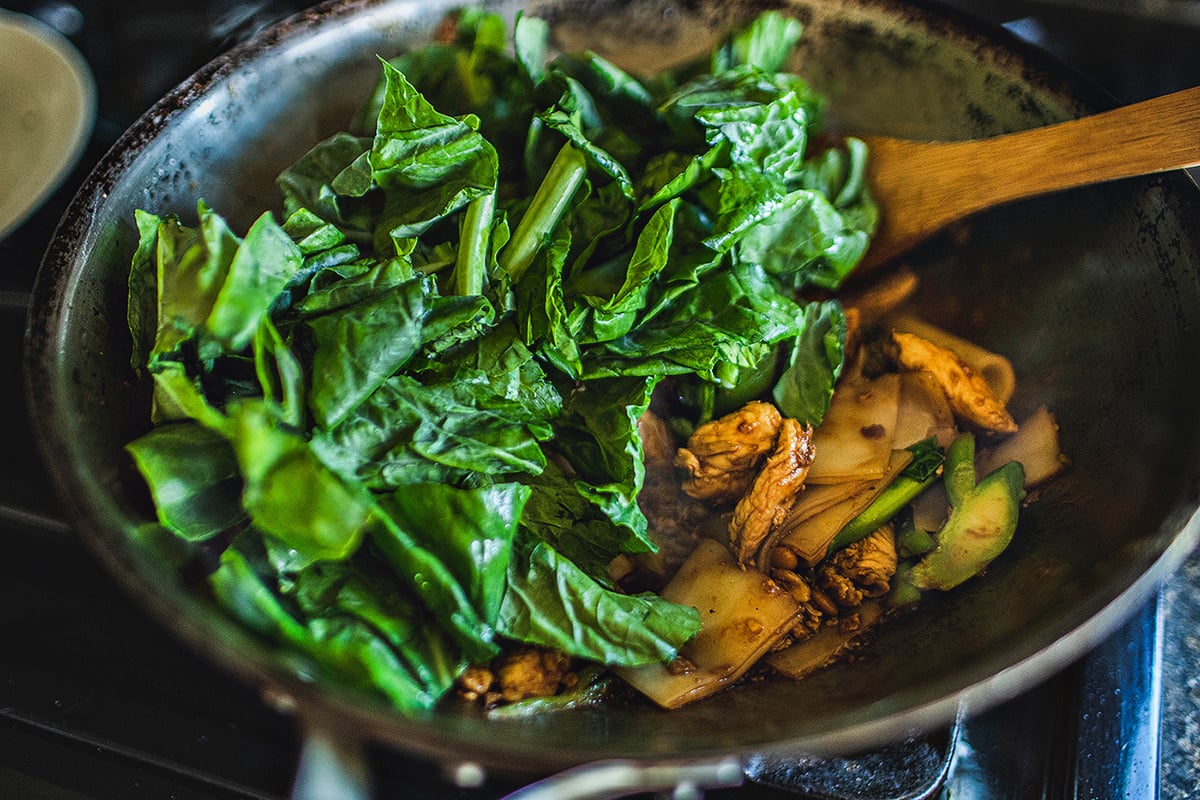 Chinese broccoli in a wok for pad see ew. 