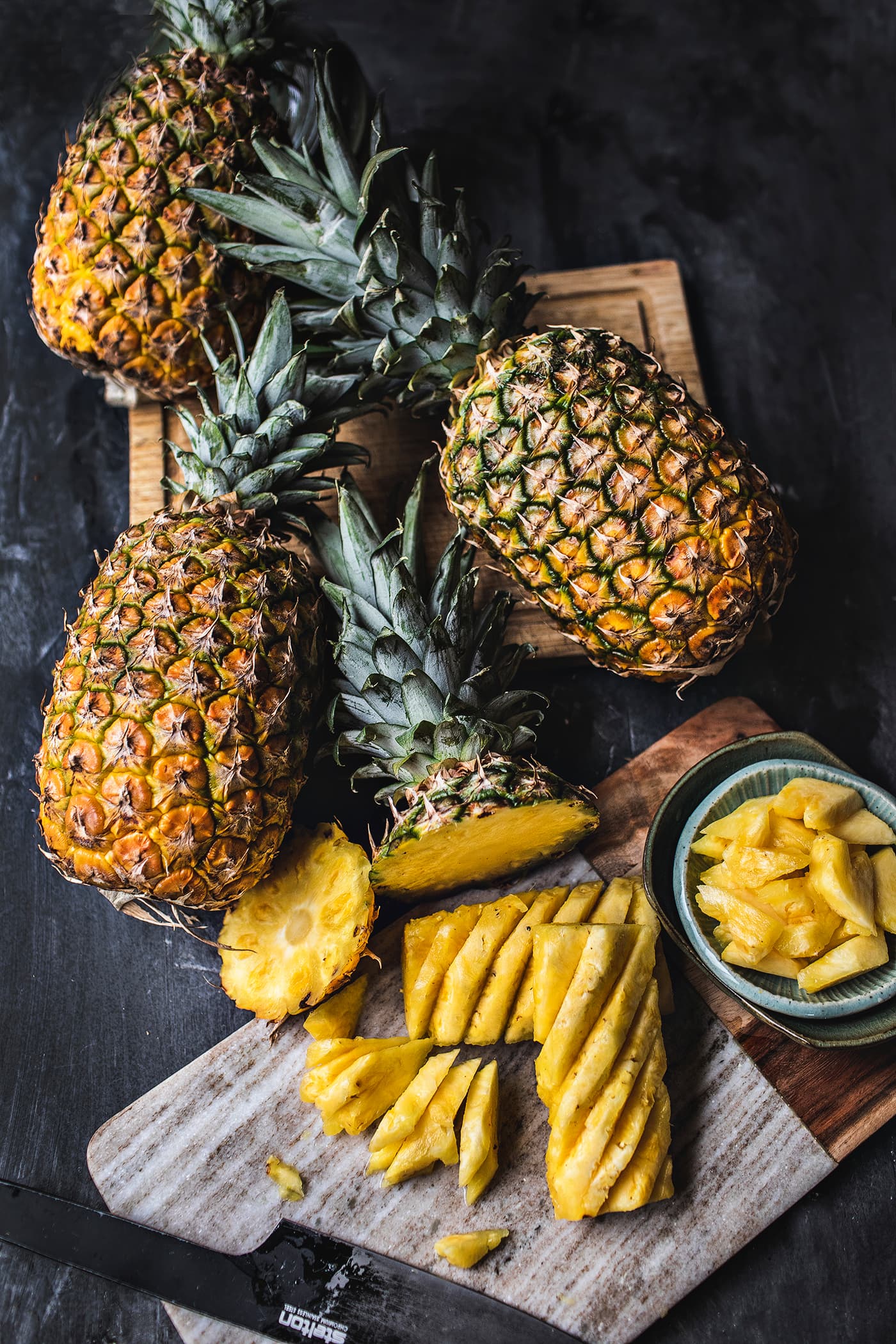 Do you love pineapples but have always been intimidated by how to cut them? Today, I'm going to show you, step by step with helpful photo instructions, how to cut a pineapple, AND  how to to make a pineapple bowl! Get ready to be an expert at cutting your favorite fruit.  #pineapples #howtocutpineapple #cuttingpineapple #pineapplecutting 
