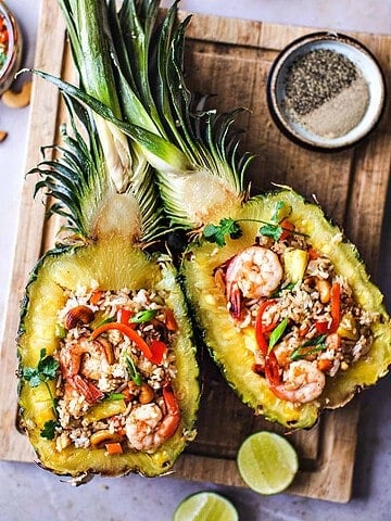 Thai pineapple fried rice on pineapple boats.