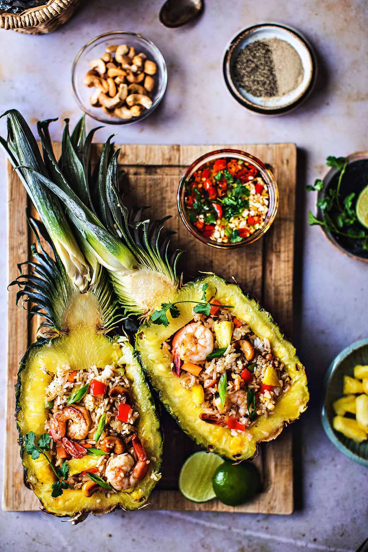 Pineapple fried rice with shrimp in pineapple bowls