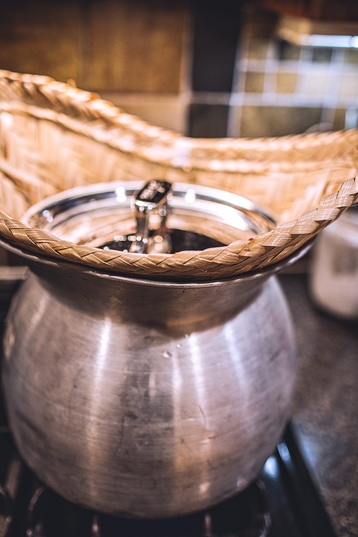 bamboo basket inside an aluminum pot