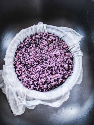 purple rice in cheese cloth