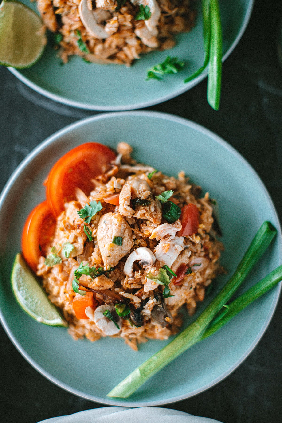 Chicken Tom Yum fried rice on a blue platter.