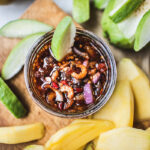 guava dipped inside a bowl of sauce
