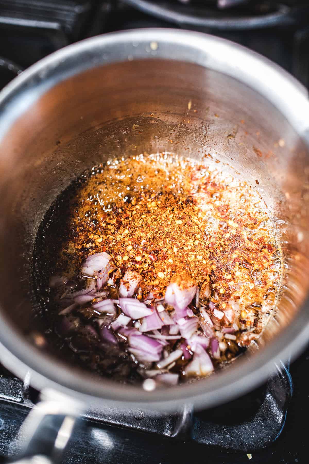 Mango dipping sauce in a pot on the stove. 