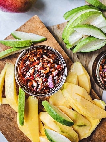 Thai spicy mango dipping sauce with mango slices.