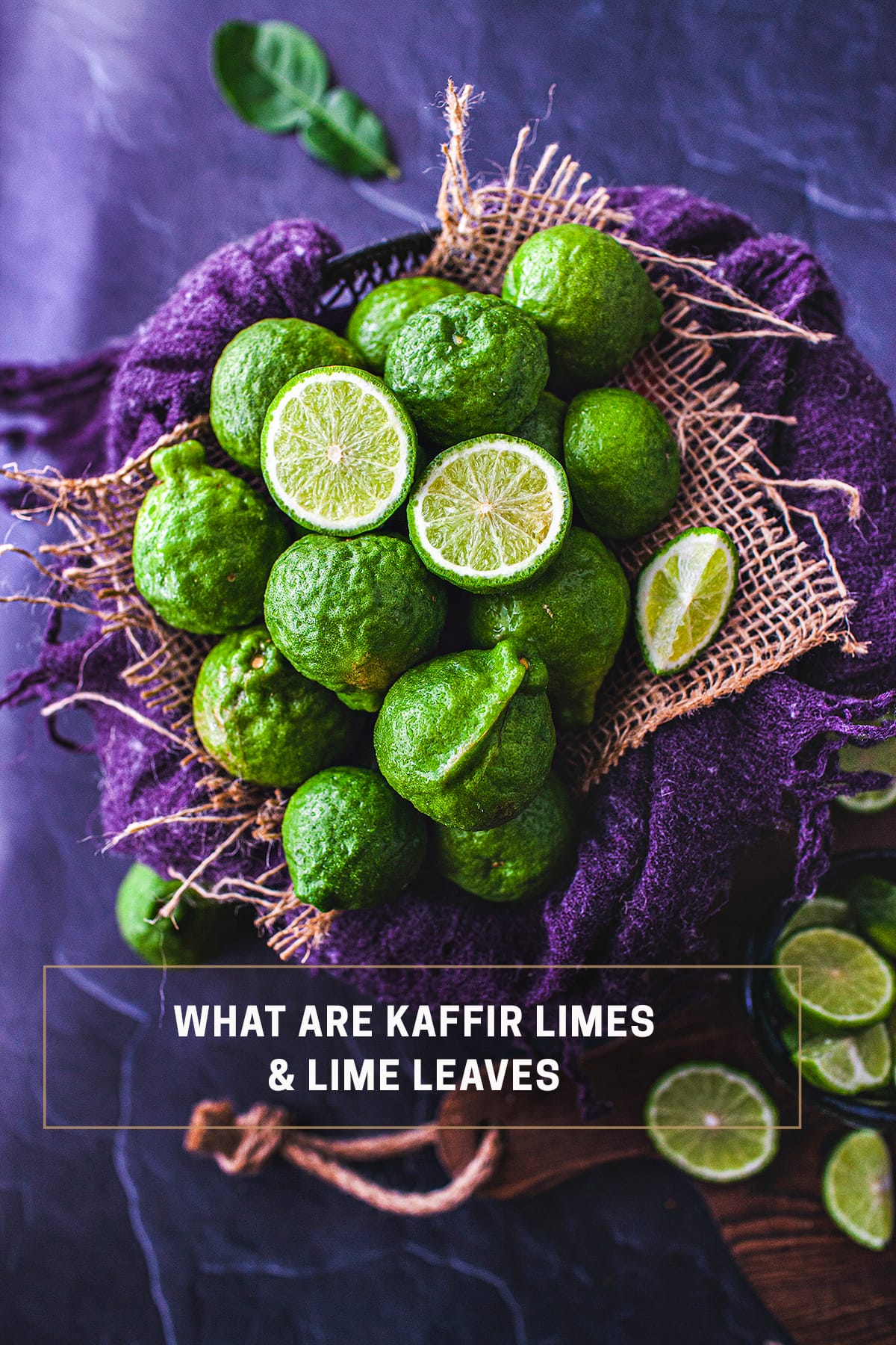 Kaffir limes in a basket with purple towel