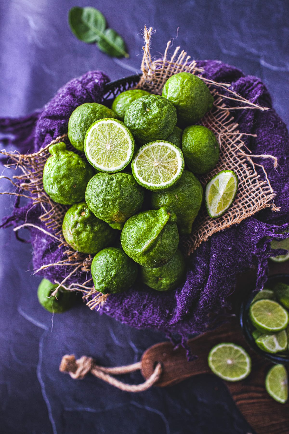 kaffir limes on purple linen