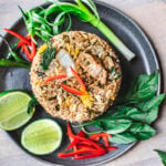 fried rice on a plate with garnishes.