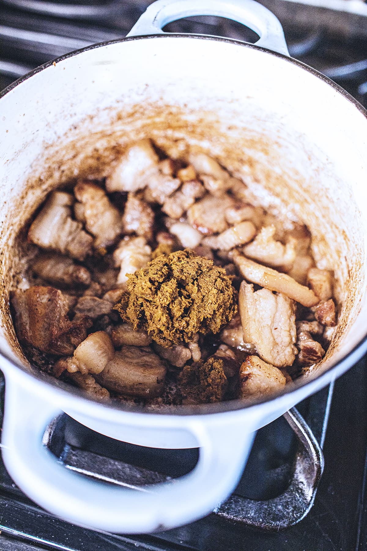 pork belly with yellow curry in a soup pot