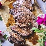 sliced beef on cutting board