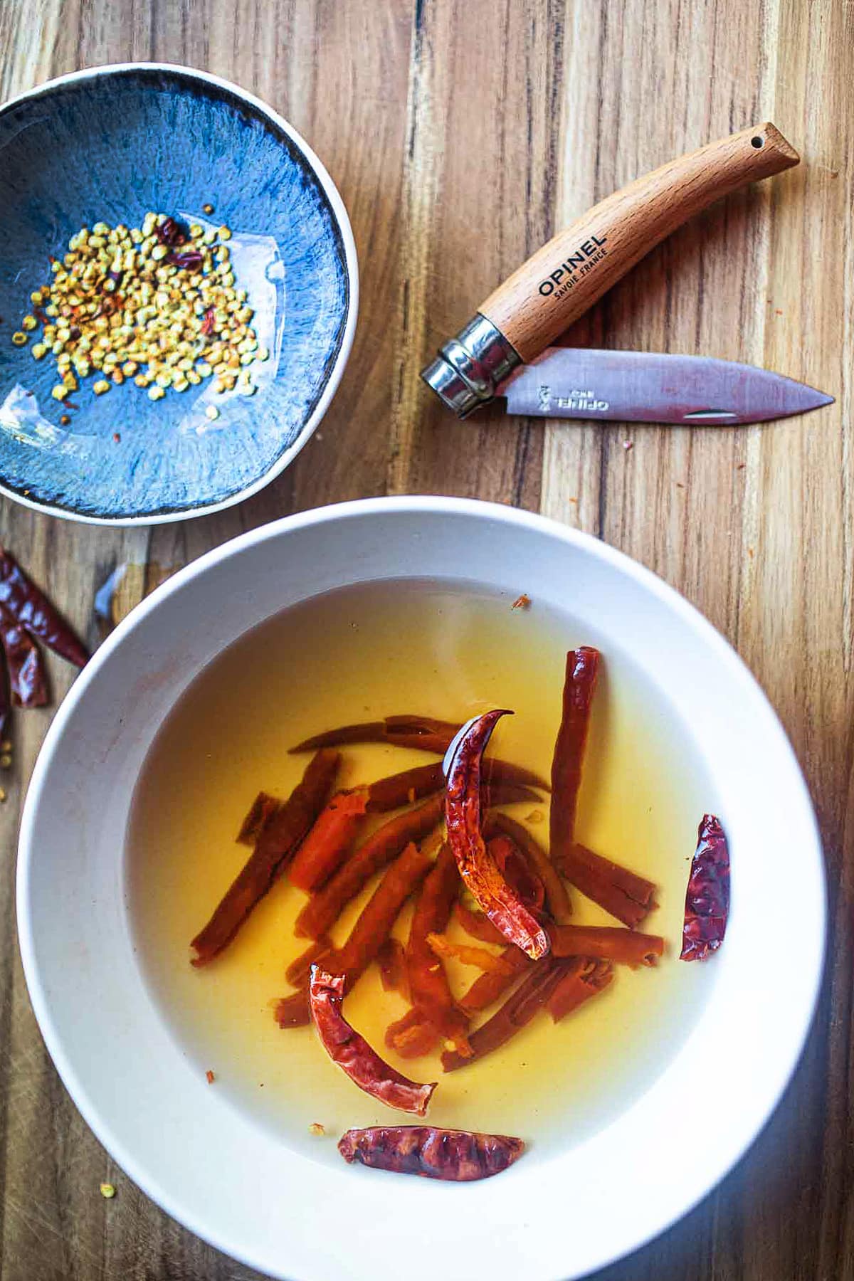 Thai dried chilis soaking in a bowl.