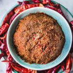 Prik Khing curry paste in small green bowl.