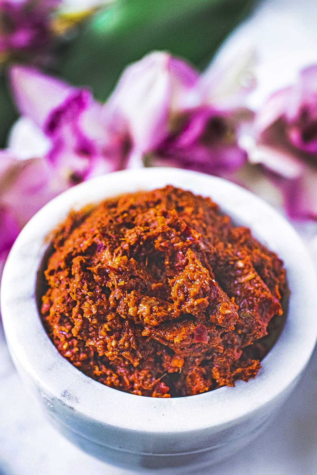 red curry paste in a small white bowl