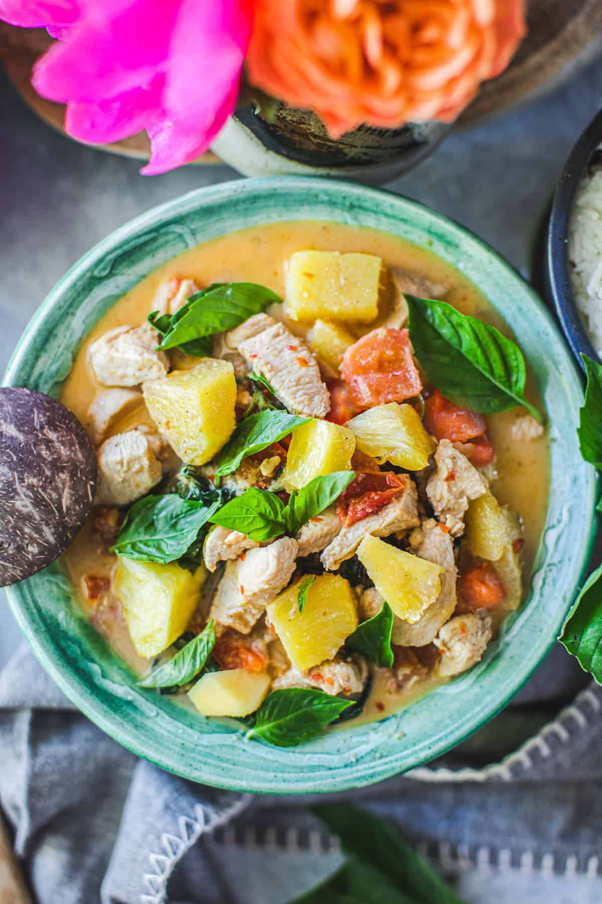 pineapple curry in a green bowl