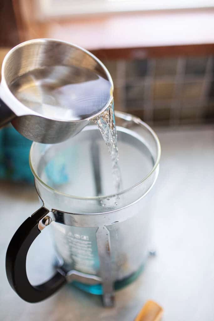 hot water pouring into a french press.