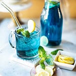 butterfly pea flower tea in a glass with ice