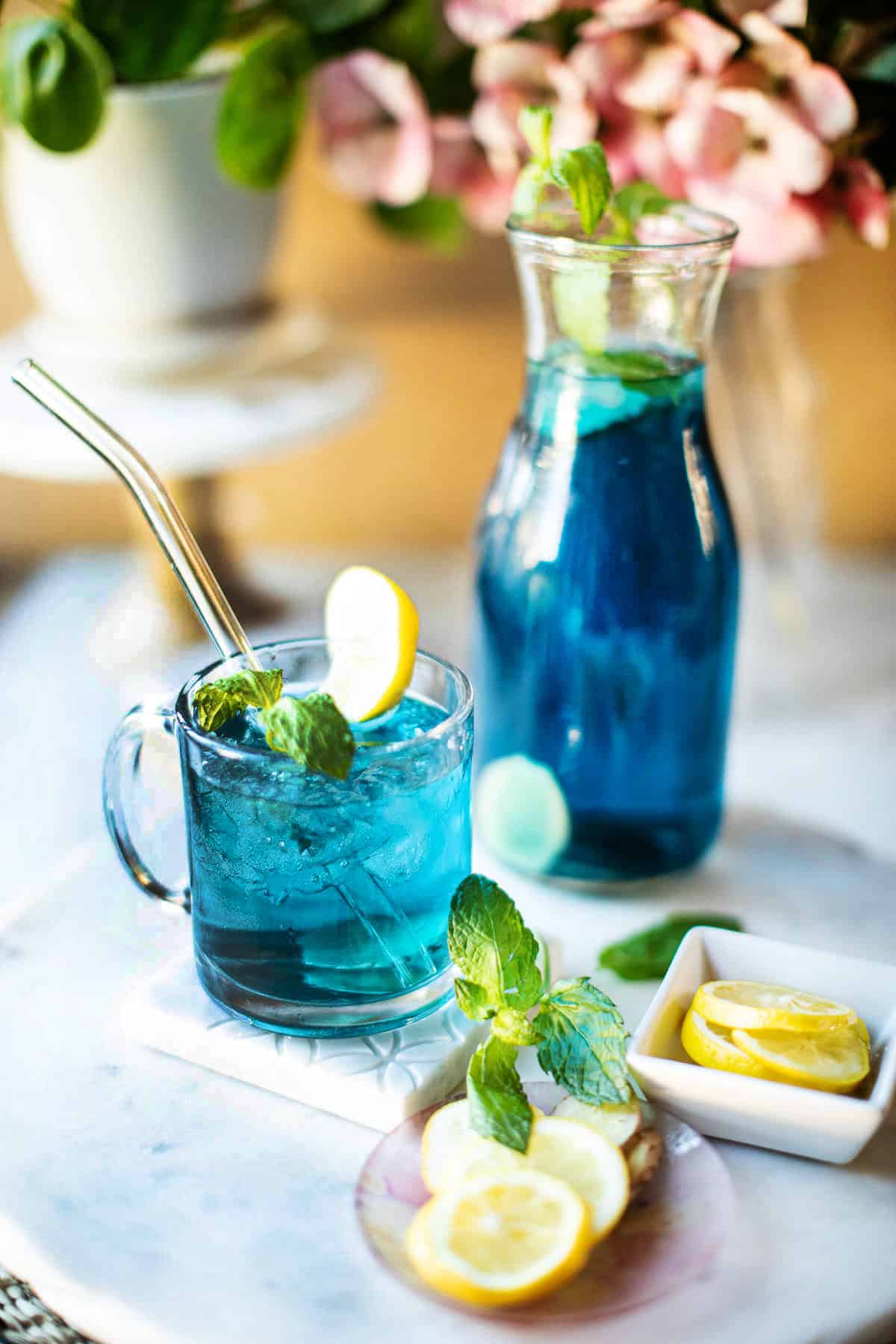 butterfly pea flower tea in a glass with ice.