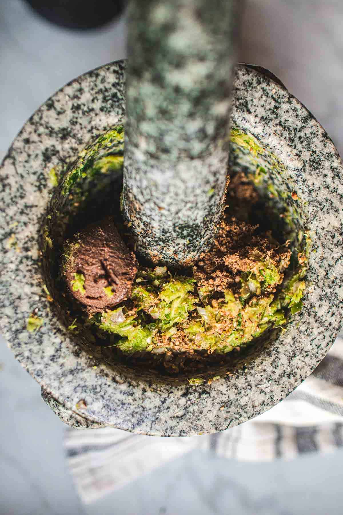 thai green curry paste in mortar and pestle