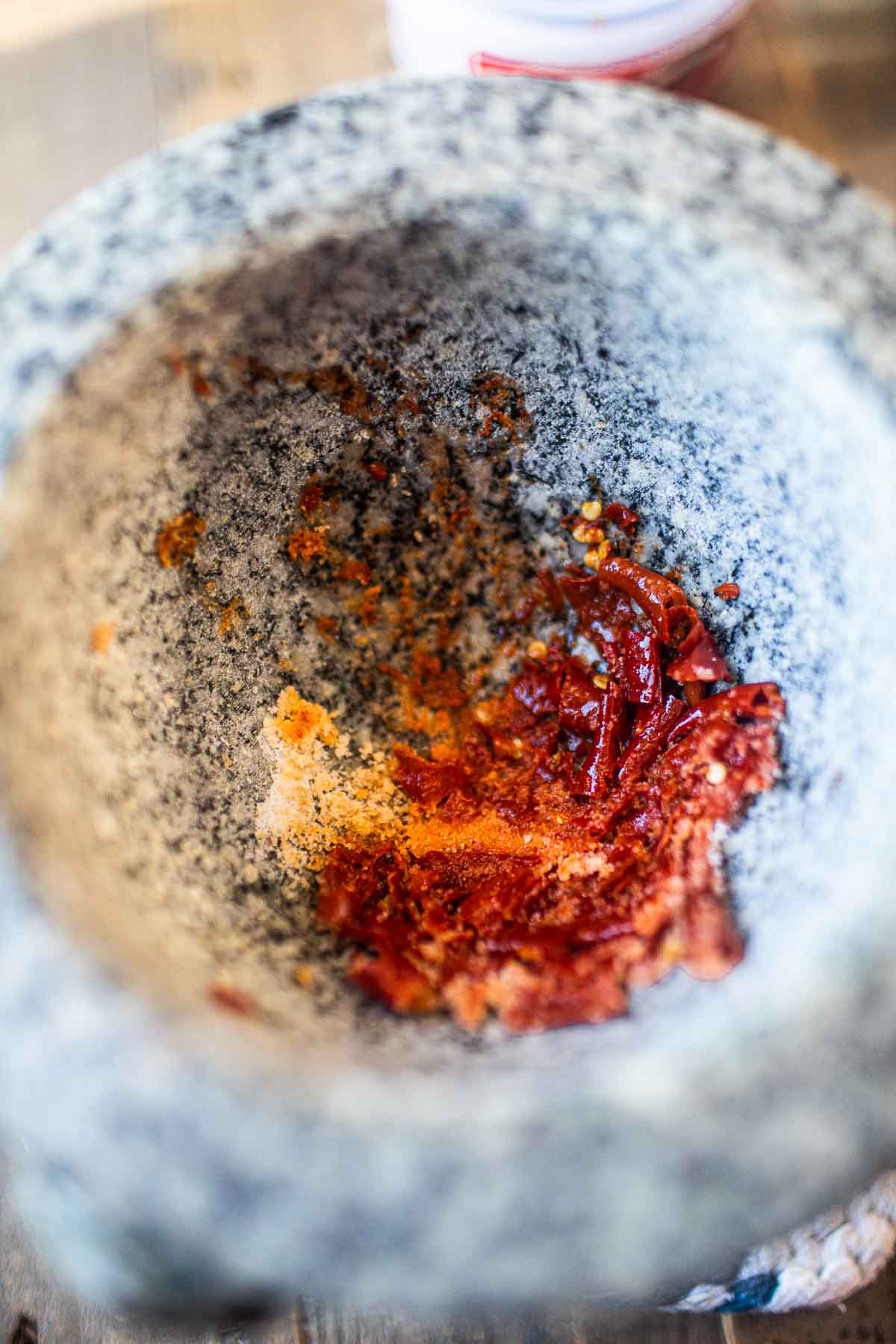 curry paste ingredients in mortar and pestle