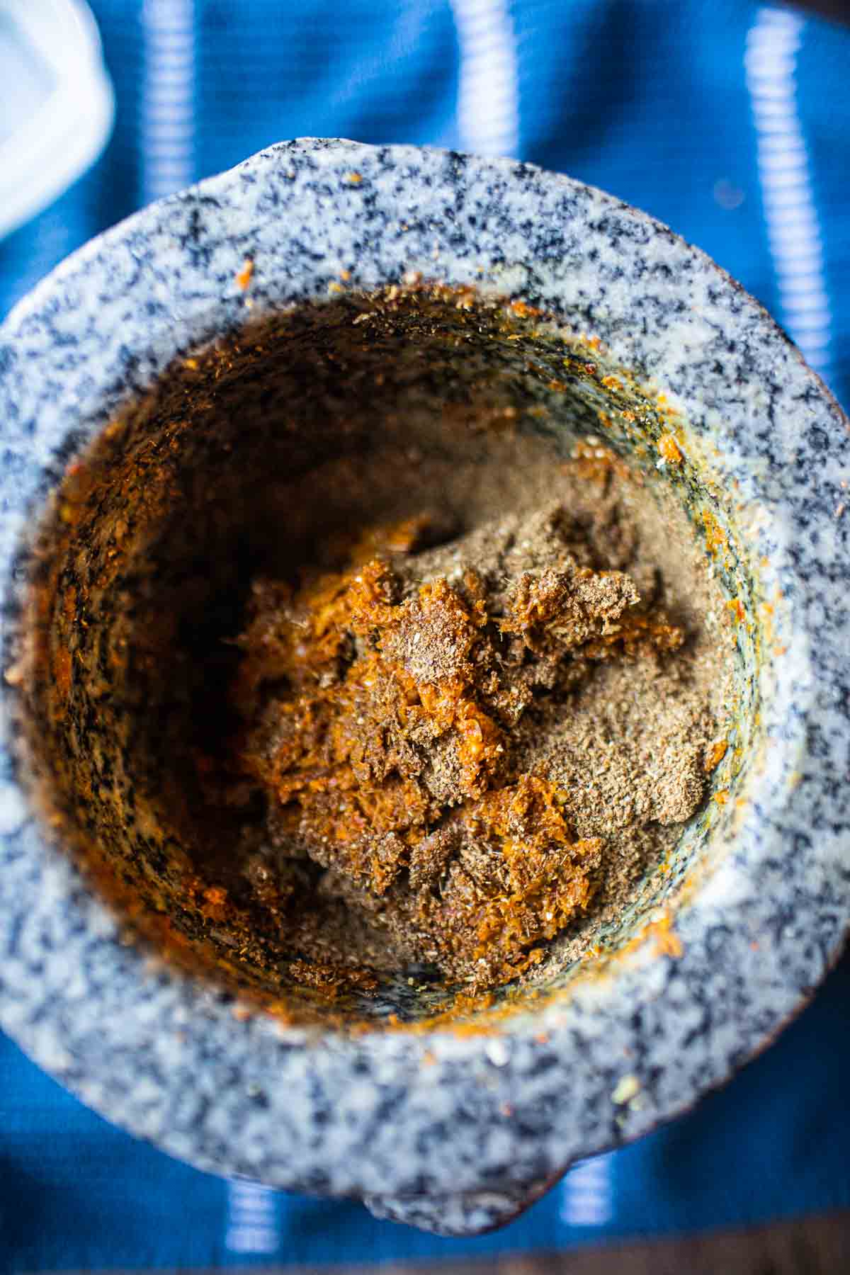 curry paste ingredients in mortar and pestle