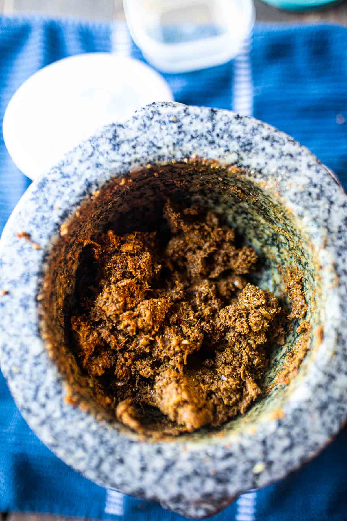 curry paste ingredients in mortar and pestle