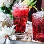 Thai hibiscus tea in a glass on a tray.