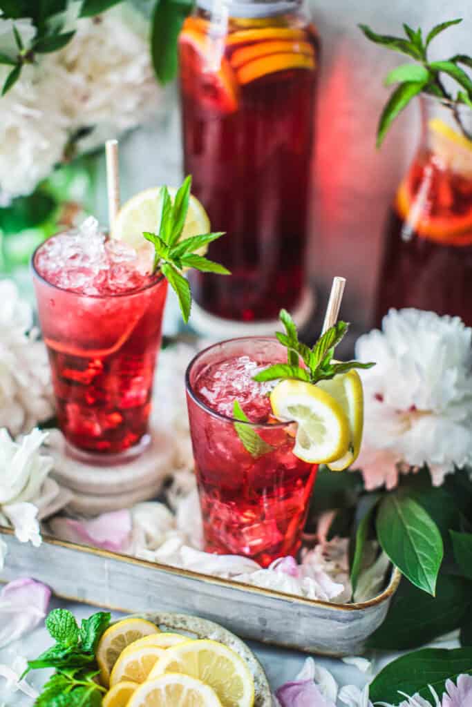 glasses of Hisbiscus tea on a tray.