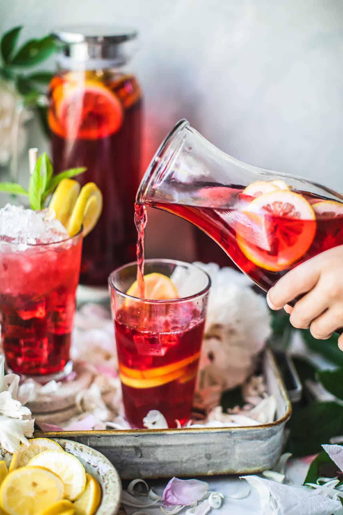 pouring hibiscus tea