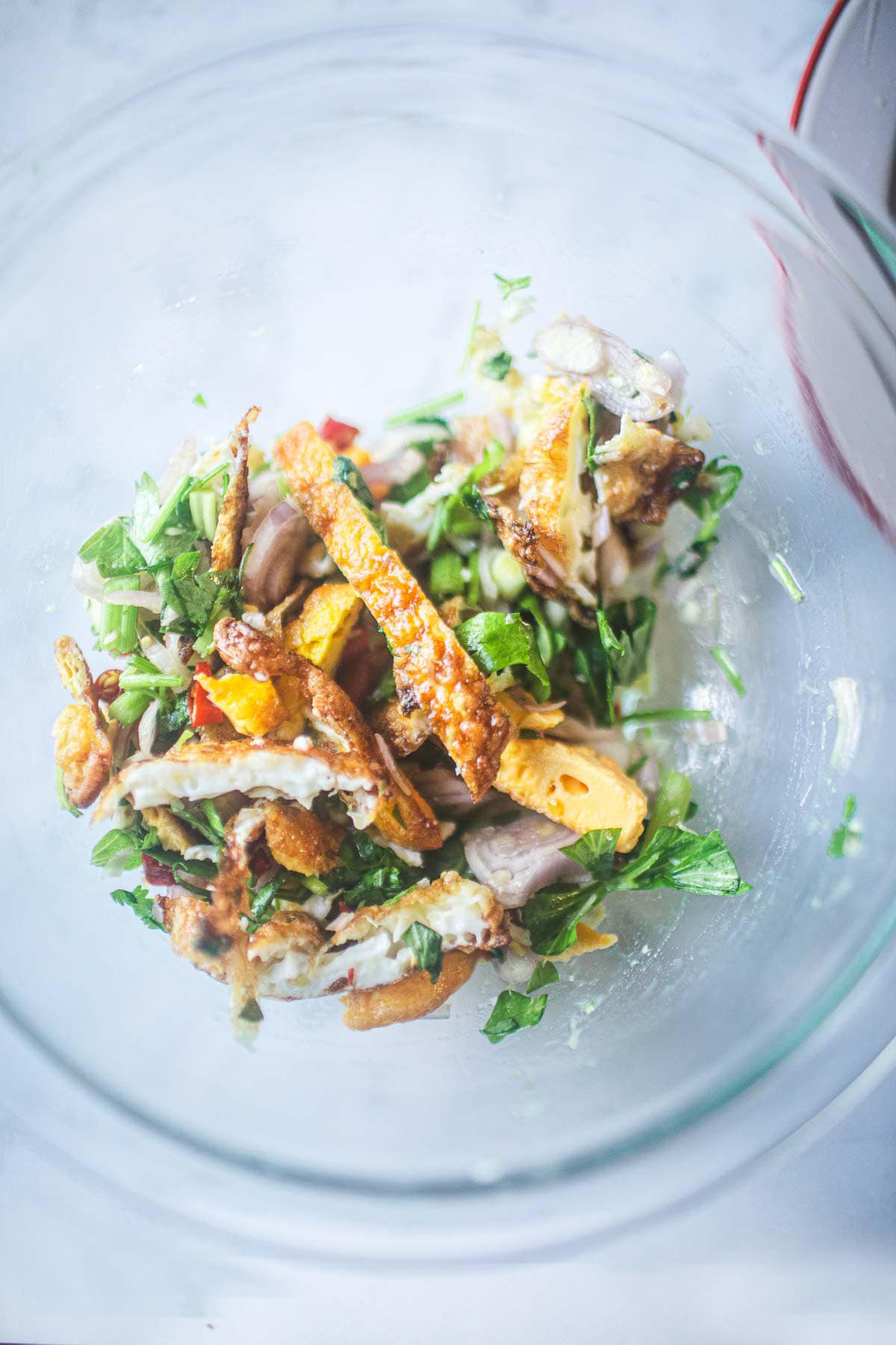 Thai fried Egg Salad in a glass bowl