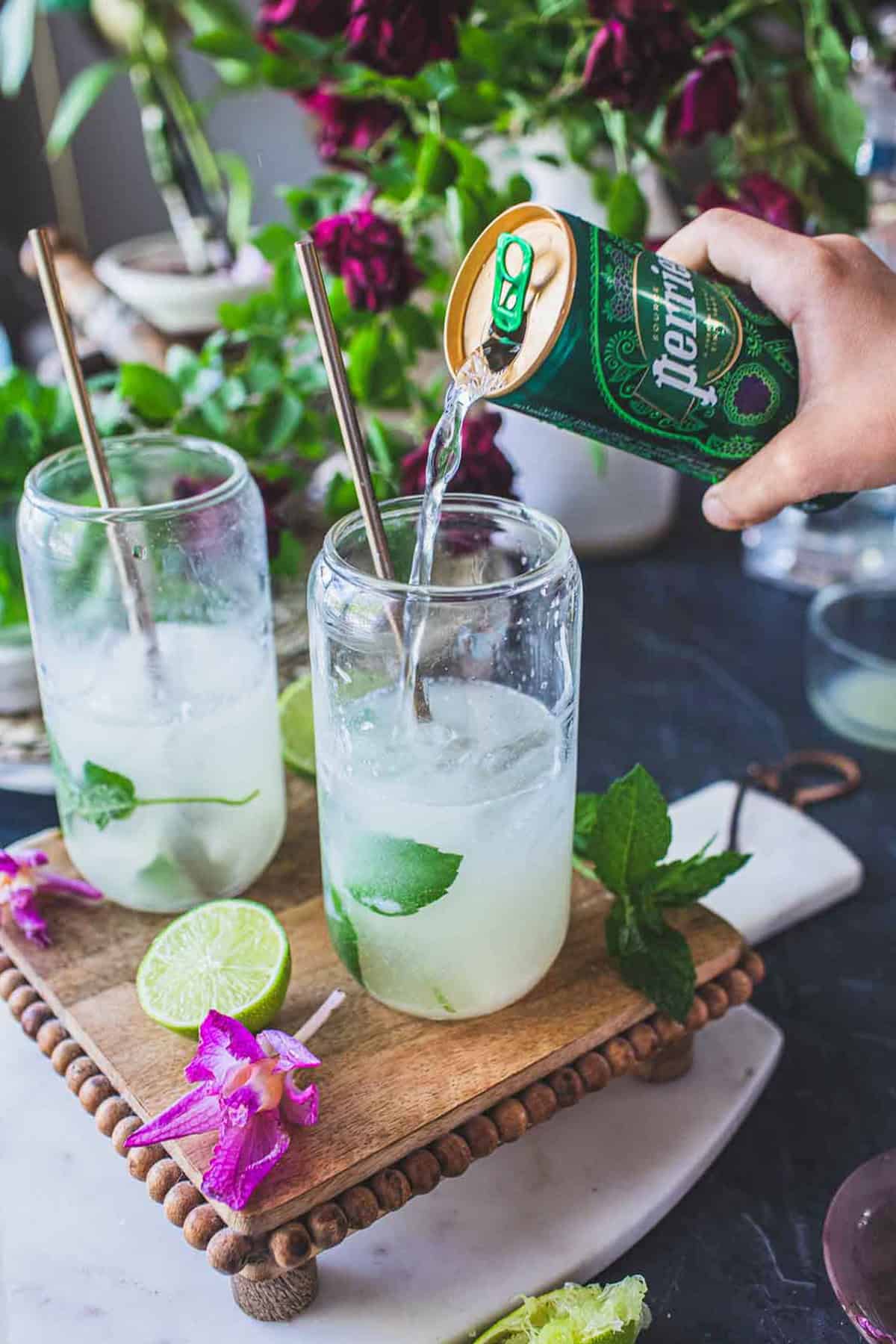 perrier poured over mojito glass