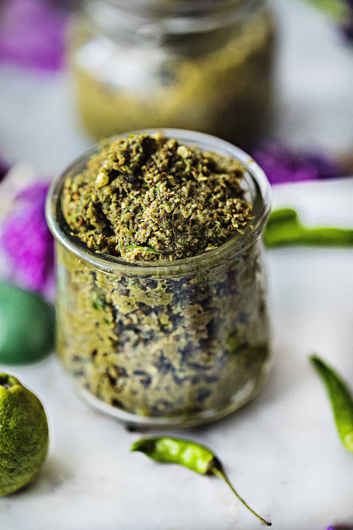 green curry paste in a clear small jar