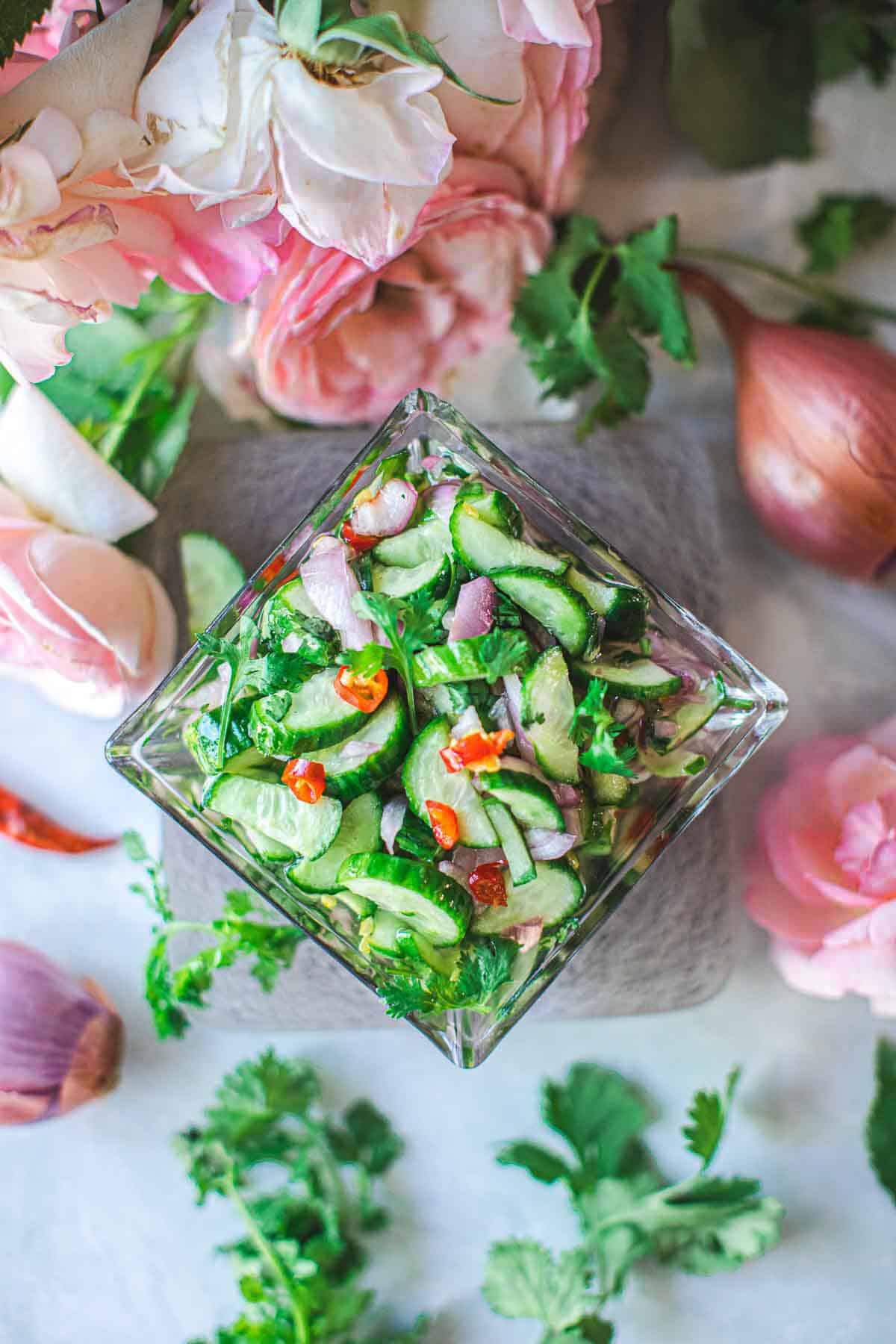 cucumber salad in a square glass bowl