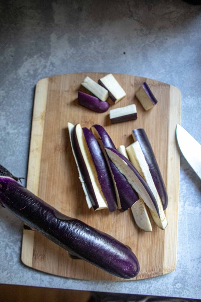 Chinese eggplant chopped into long and small pieces.