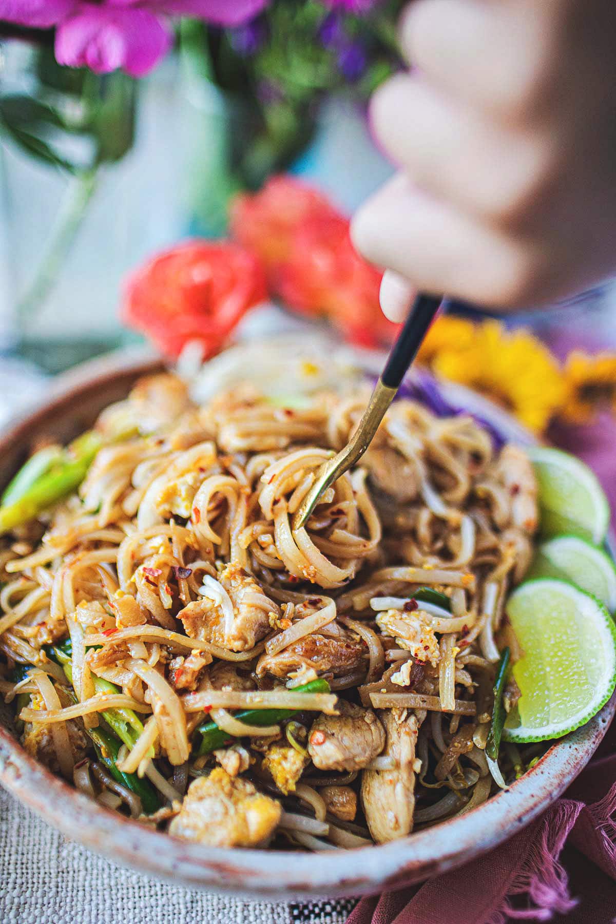 fork lifting noodles in pad mee korat 