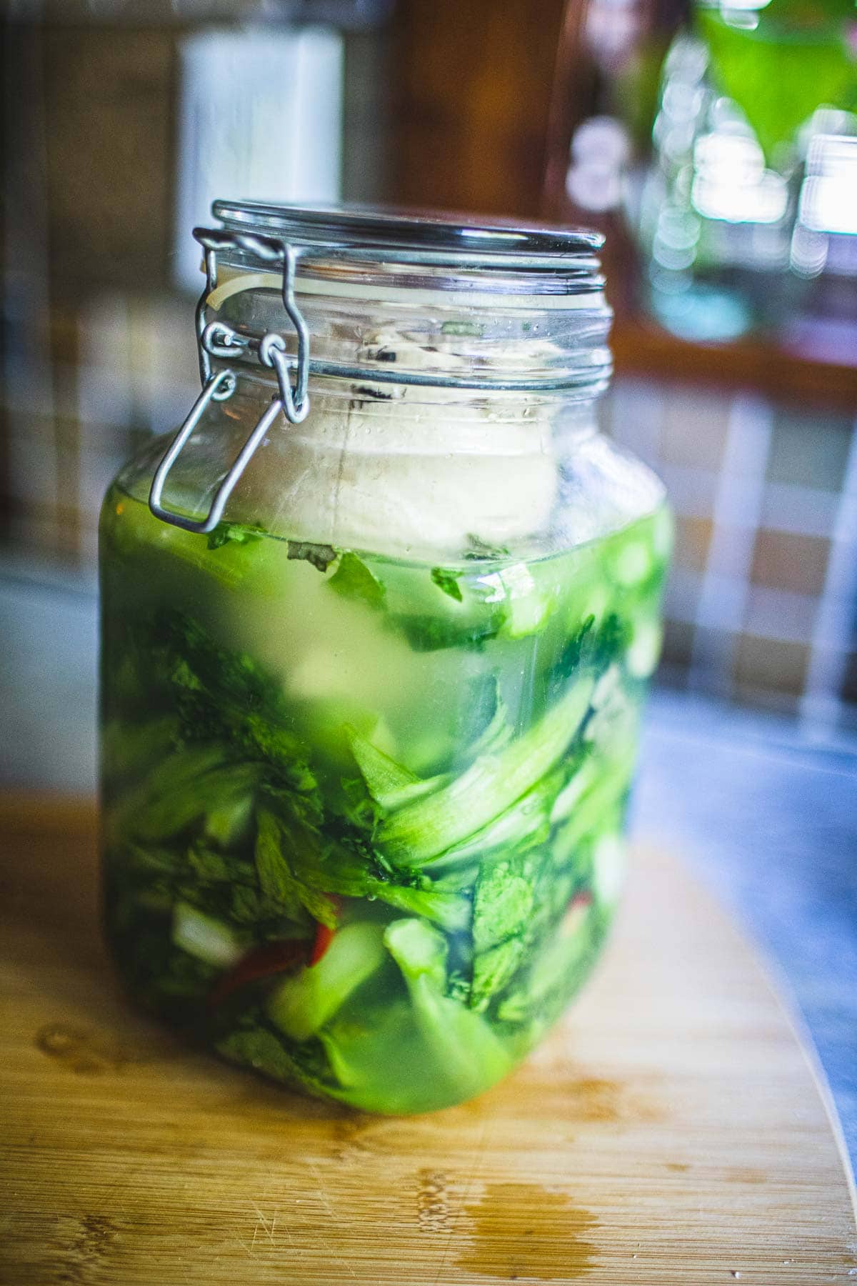 mustard greens in a closed lid jar