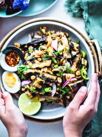 handholding eggplant salad