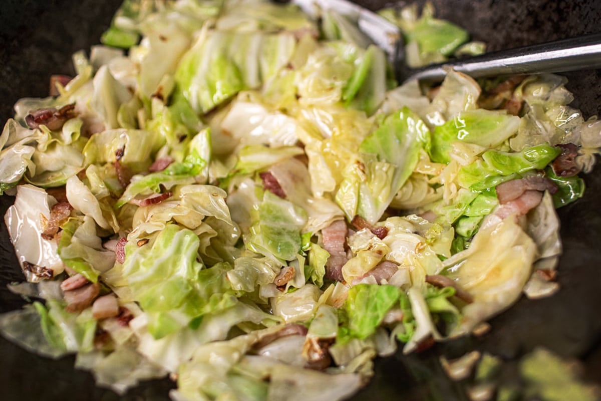 stir fried cabbage in a wok