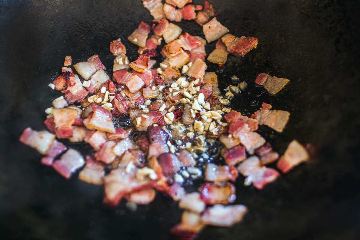 Bacon, garlic, chili in a wok