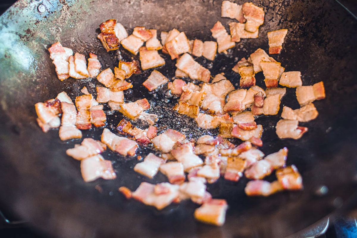 Bacon cooking in a wok