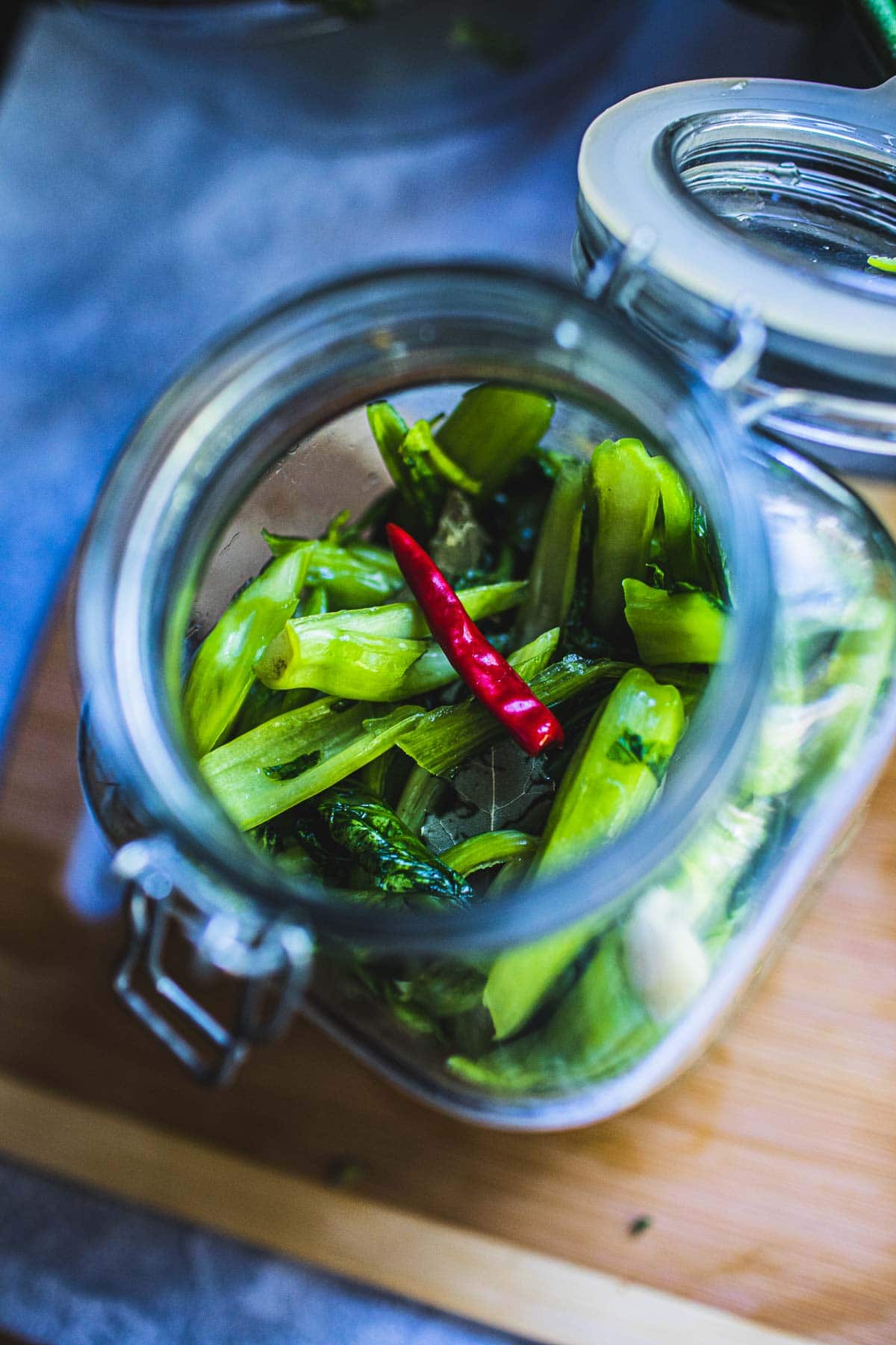 pickled mustard greens in a glass jar