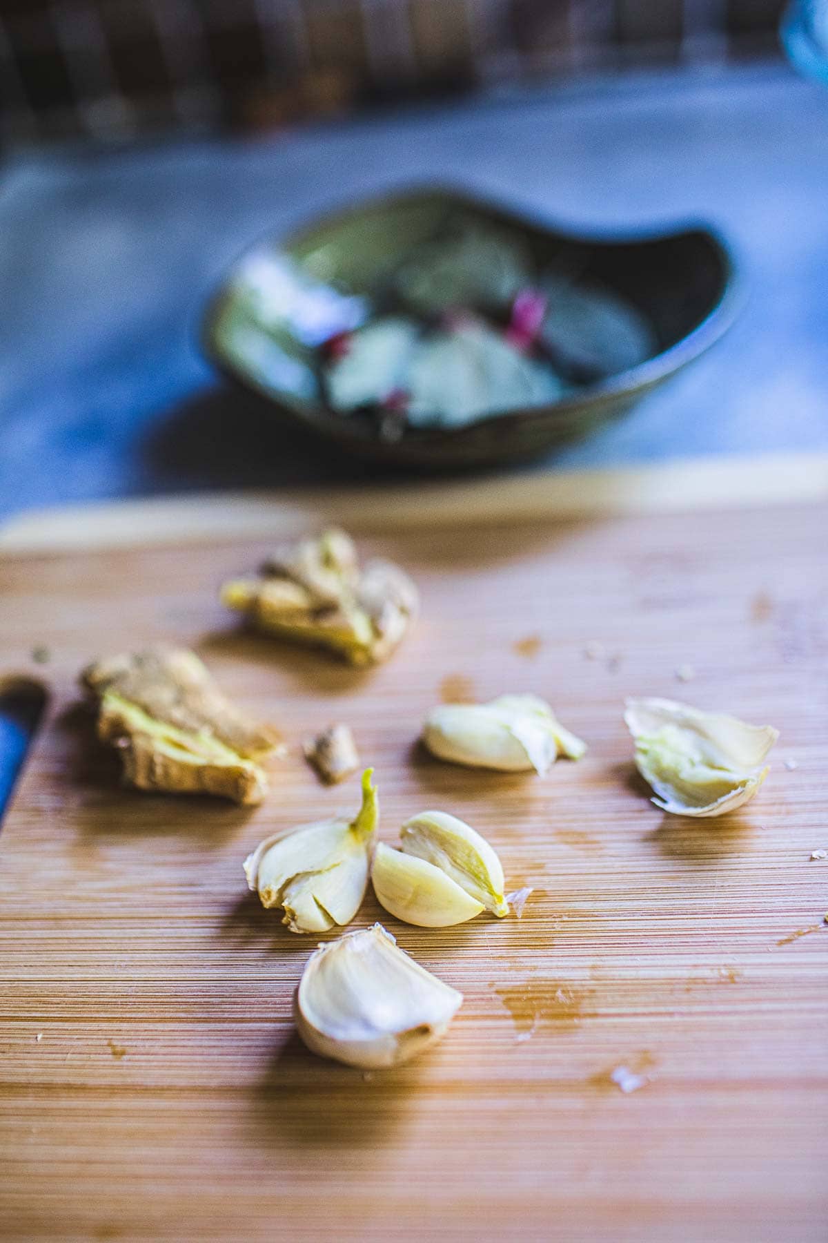 smashed garlic on cutting board