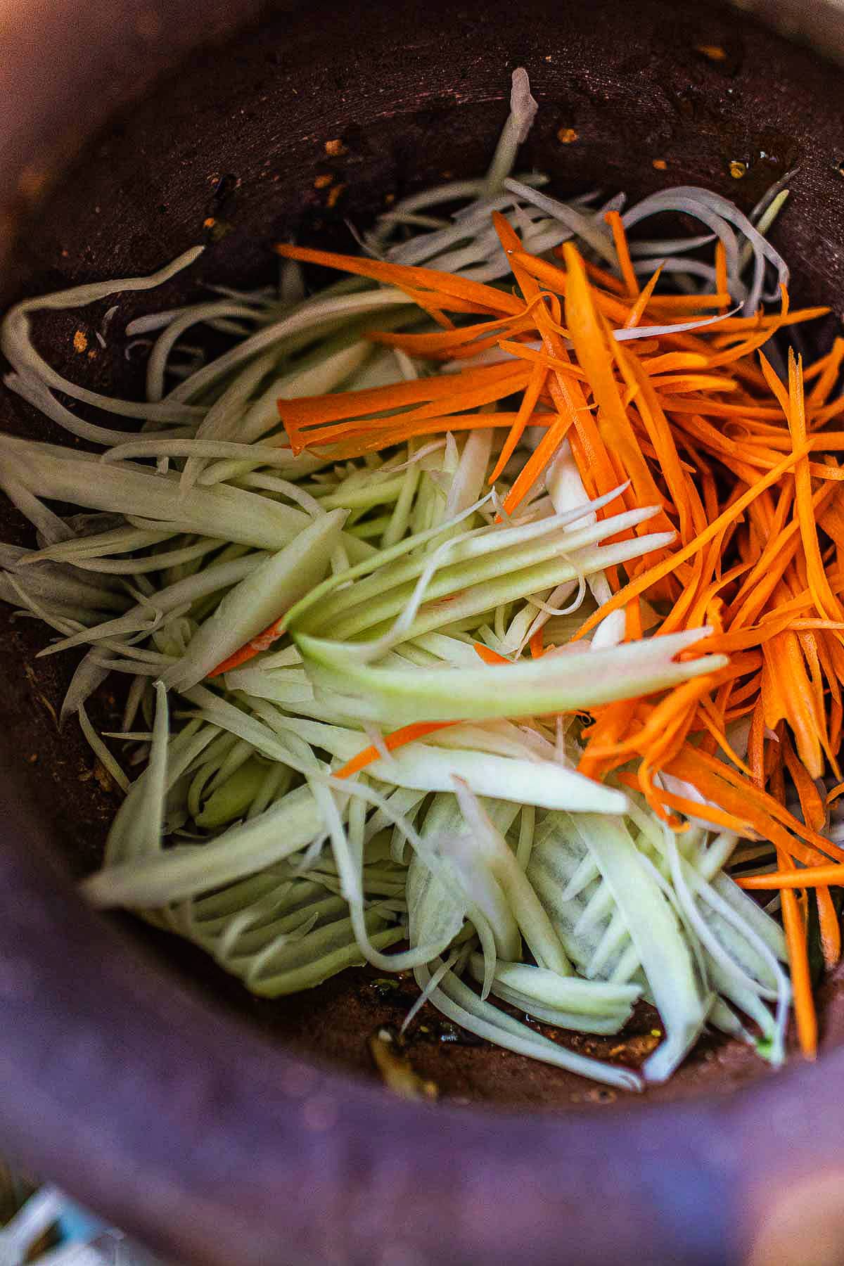 shredded papaya carrot in mortar