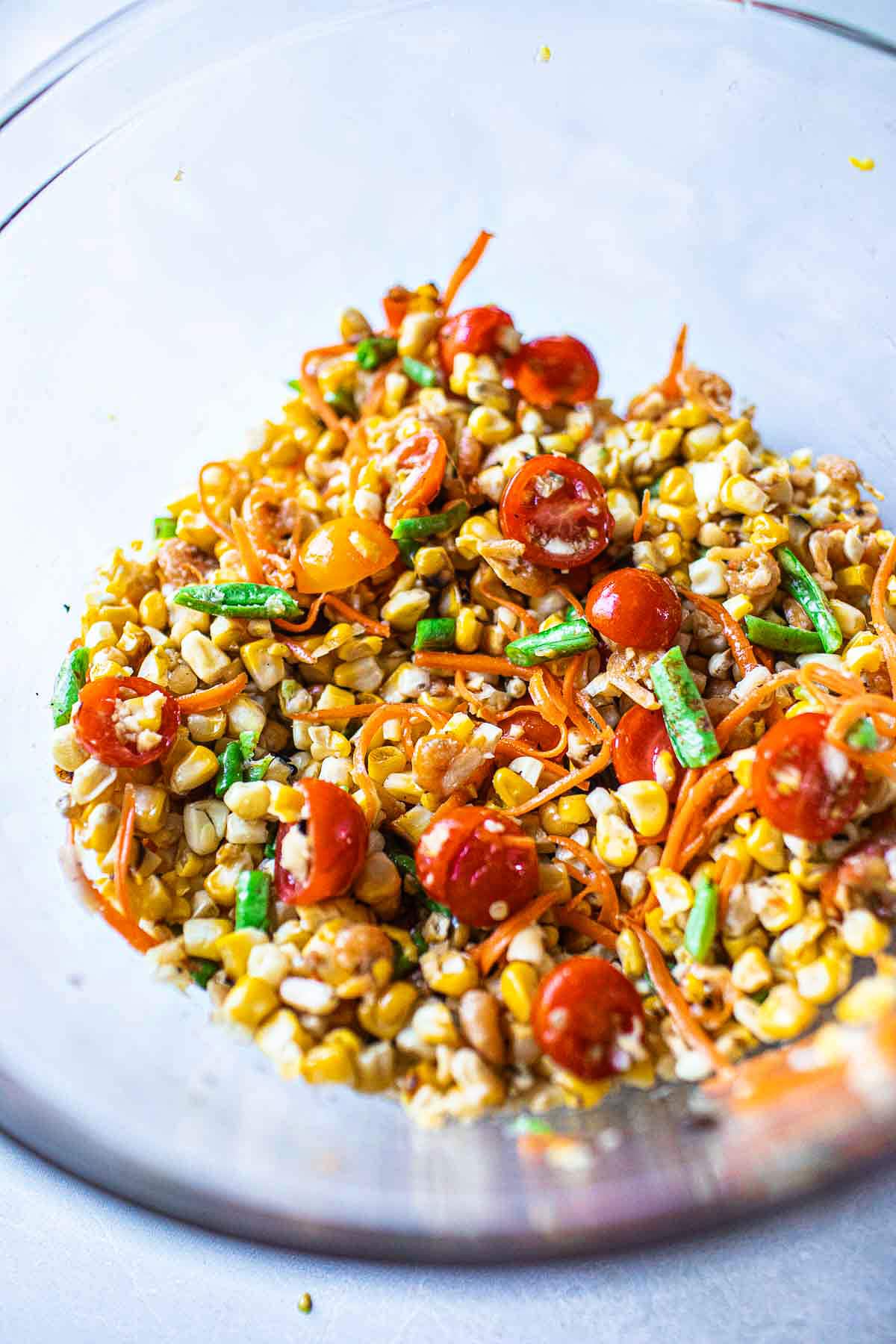 thai corn salad in a glass bowl