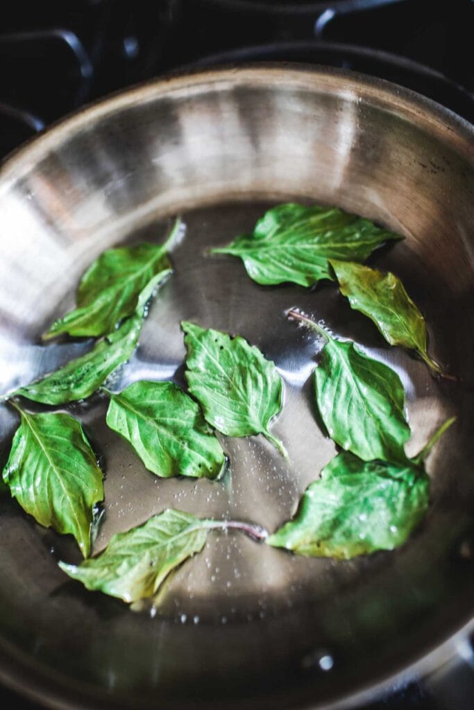fried basil in a pan