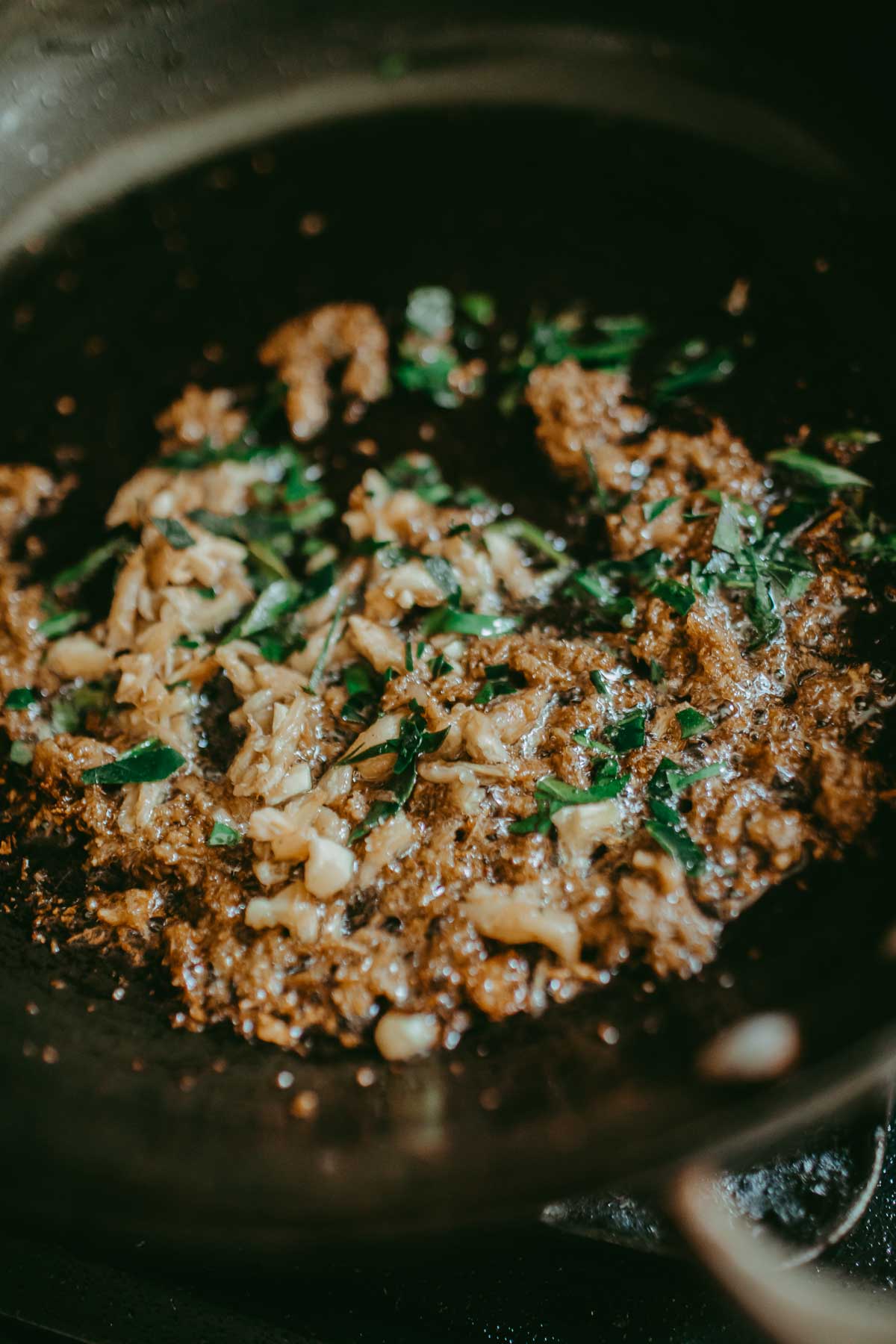 frying red curry with kaffir leaves and krachai