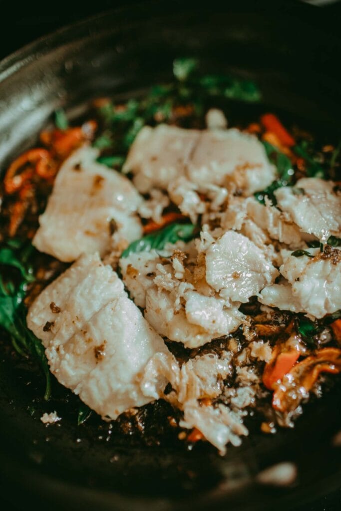 spicy catfish stir fry in a pan
