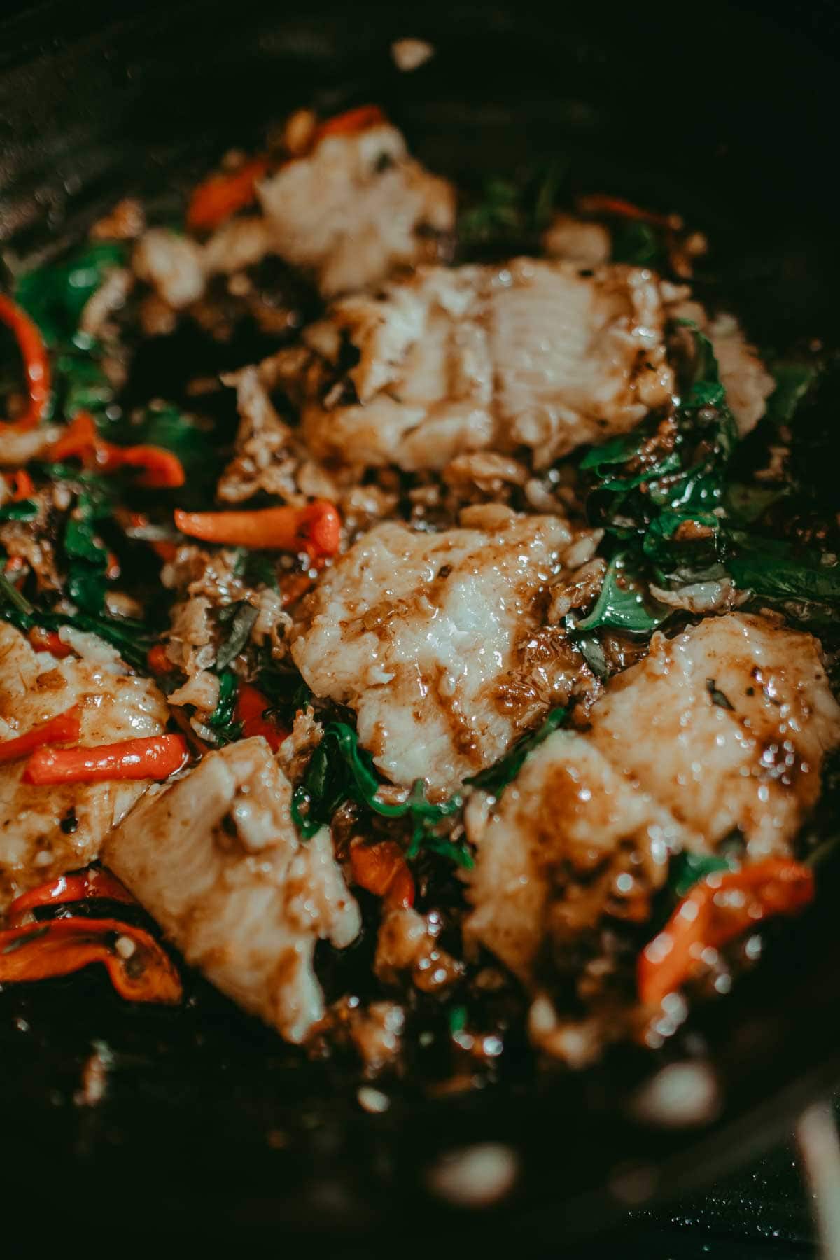spicy catfish stir fry in a pan