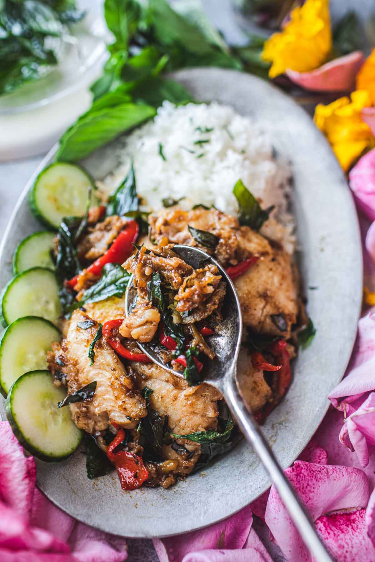 Thai spicy catfish recipe with red curry on a plate with rice 